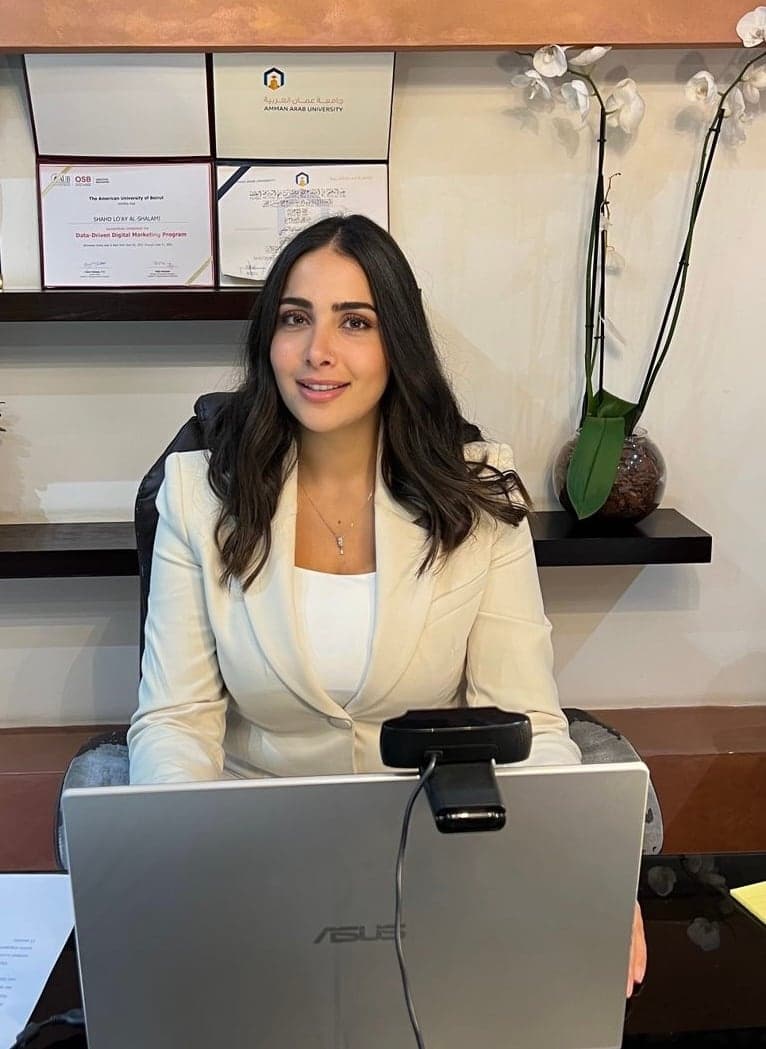 Dr. Shahd Alshalami at her desk, ready for an online session
